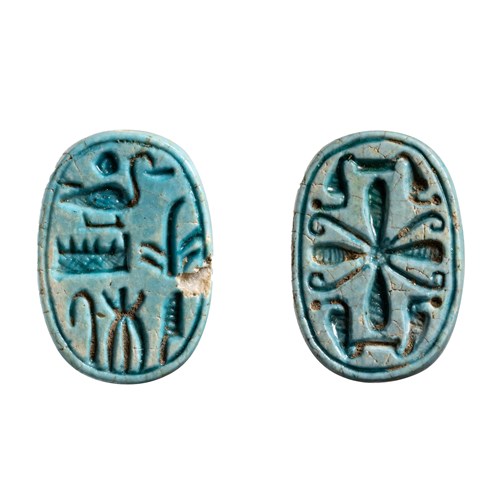 A Second IP to New-Kingdom blue faience scaraboid seal.